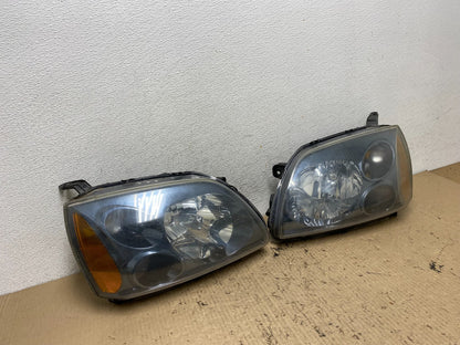 2004 to 2009 Mitsubishi Galant Left+Right Headlights Halogen AF7197 DW2
