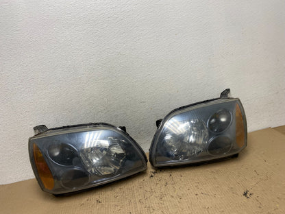 2004 to 2009 Mitsubishi Galant Left+Right Headlights Halogen AF7197 DW0
