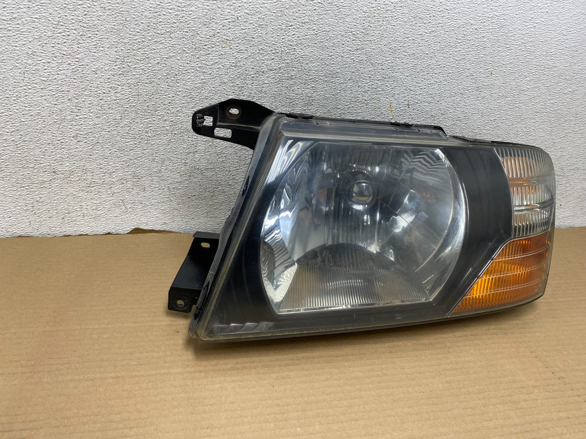2000 to 2004 Mitsubishi Montero Pajero Left Driver LH Headlight AG9311 DW1
