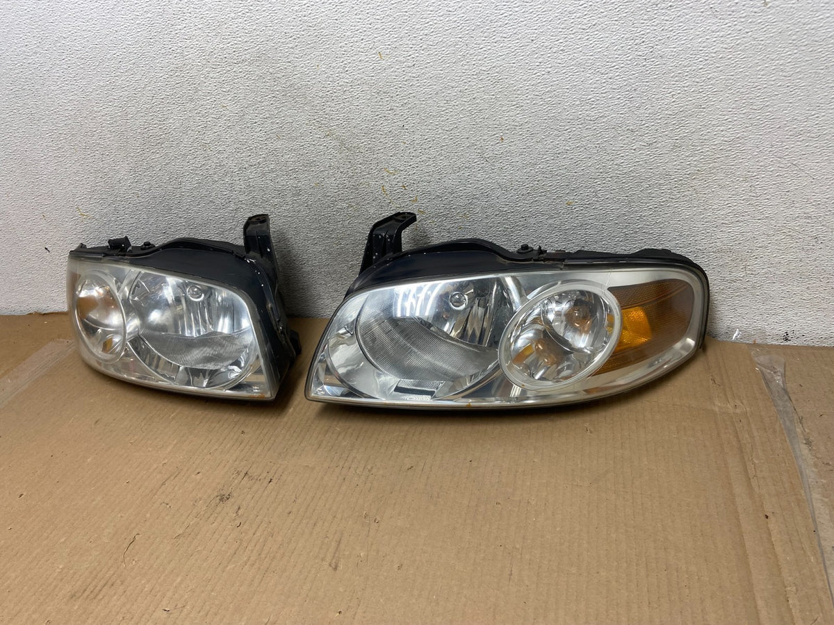 2004 - 2006 Nissan Sentra Halogen Left+Right Headlights AH3044 DW2