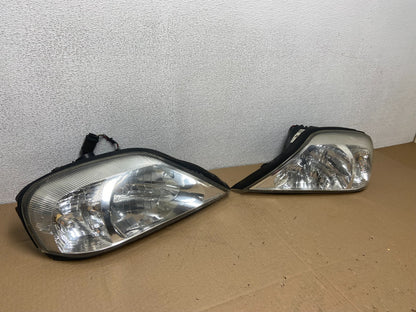 2000 to 2005 Mercury Sable Left+Right Side Set Halogen Headlights AB6122 DW2