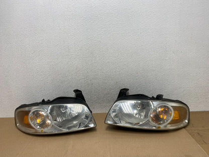 2004 - 2006 Nissan Sentra Halogen Left+Right Headlights AE6630 DW0