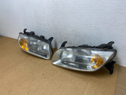 2000 to 2002 Saturn L Series Headlights Left+Right Side AE2945 DW1