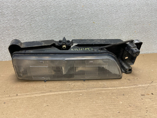 1989 to 1992 Pontiac Sunbird Right Passenger Side Headlight 16509426 AB44980