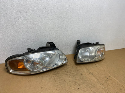 2004 - 2006 Nissan Sentra Halogen Left+Right Headlights TYC AD0566 DW2