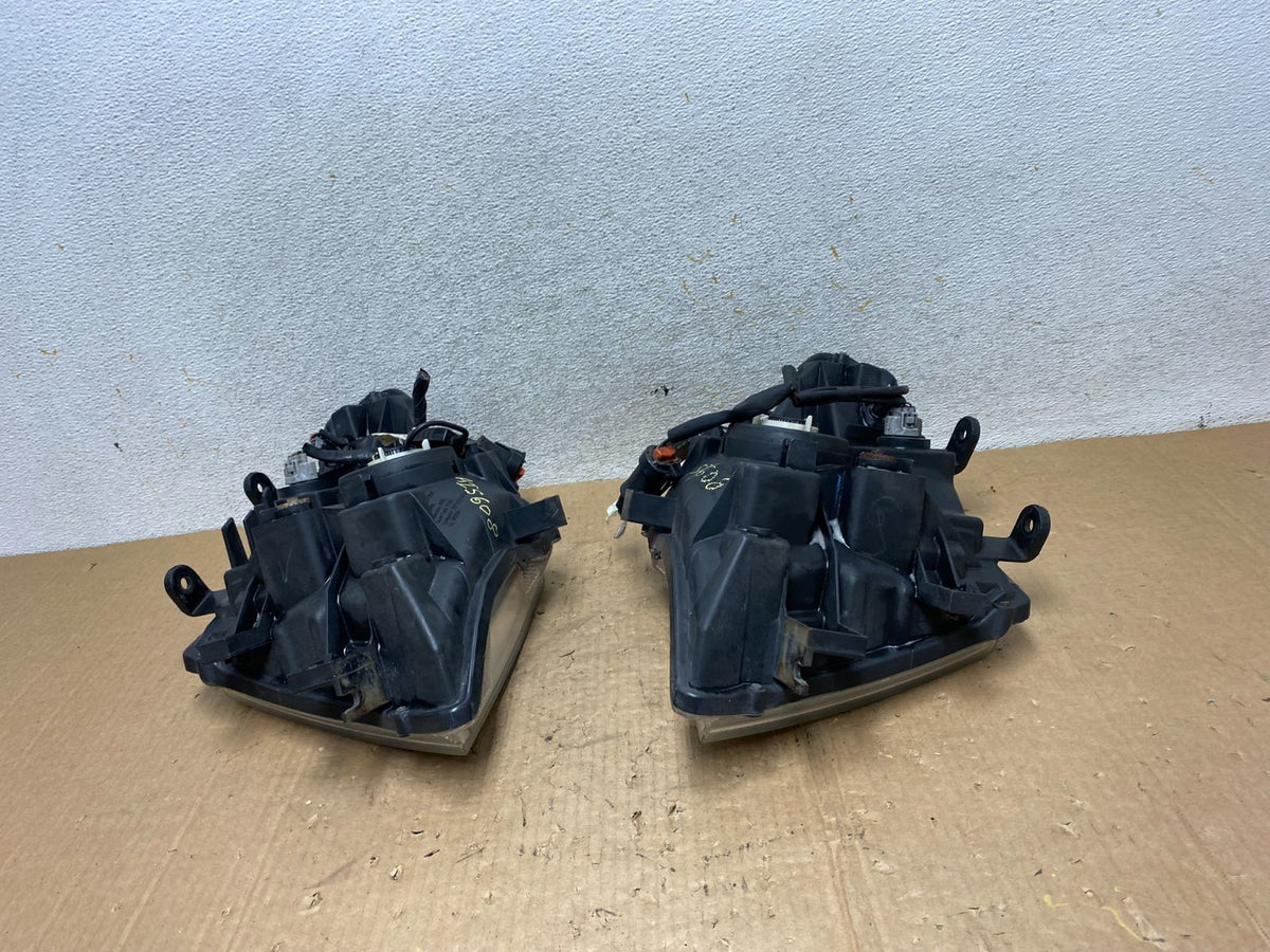 2005 2006 2007 Nissan Pathfinder Halogen Headlights Left+Right AI5608 DW10
