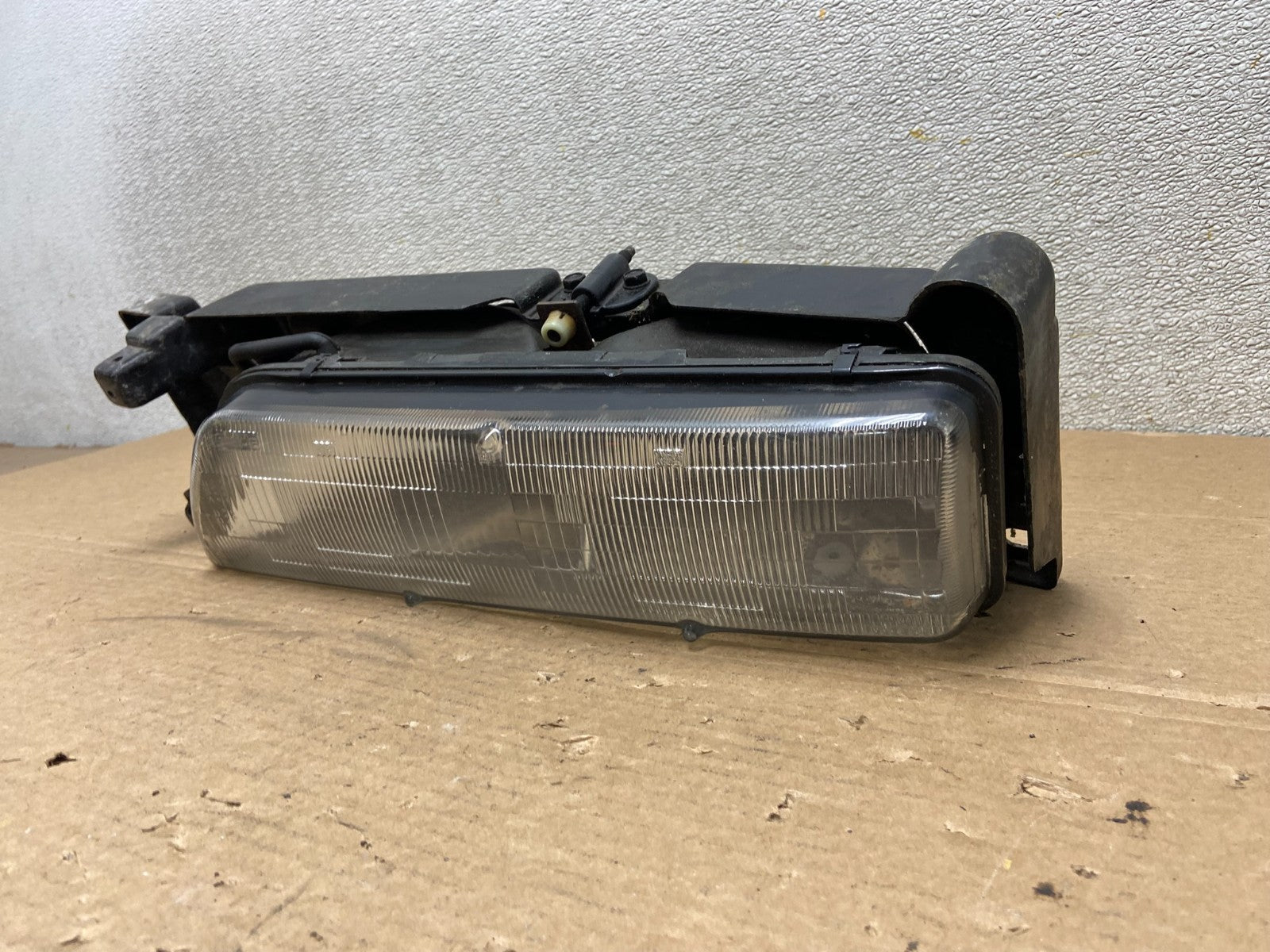 1989 to 1992 Pontiac Sunbird Left Driver Side Headlight 16509426 AB46371