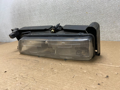 1989 to 1992 Pontiac Sunbird Left Driver Side Headlight 16509426 AB46371