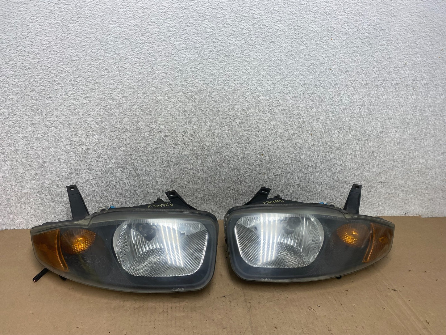 2003 - 2005 Chevrolet Cavalier Left+Right Side Black Set Headlights AG4768 DW0