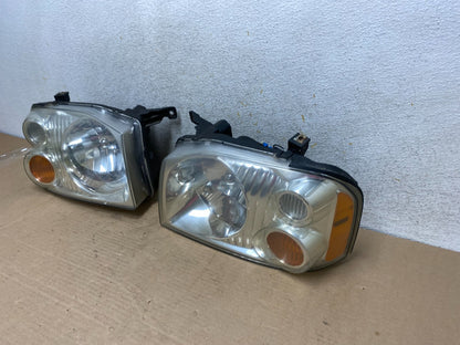 2001 to 2004 Nissan Frontier Left+Right Halogen Headlights AH9394 DW1