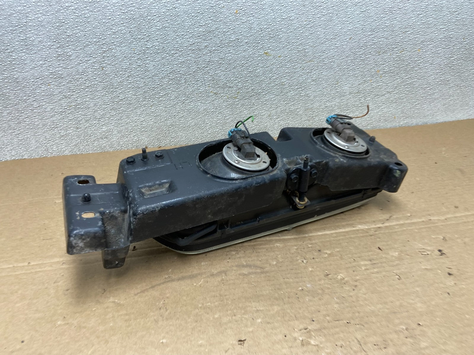 1989 to 1992 Pontiac Sunbird Left Driver Side Headlight 16509426 AB46373