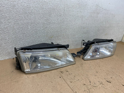 1997 to 1999 Nissan Maxima Left+Right Side Headlights Halogen OEM W1069 DW2