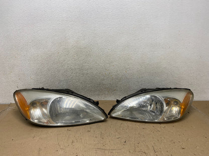 2000 to 2007 Ford Taurus Left+Right Side Halogen Headlights AH7649 DW0