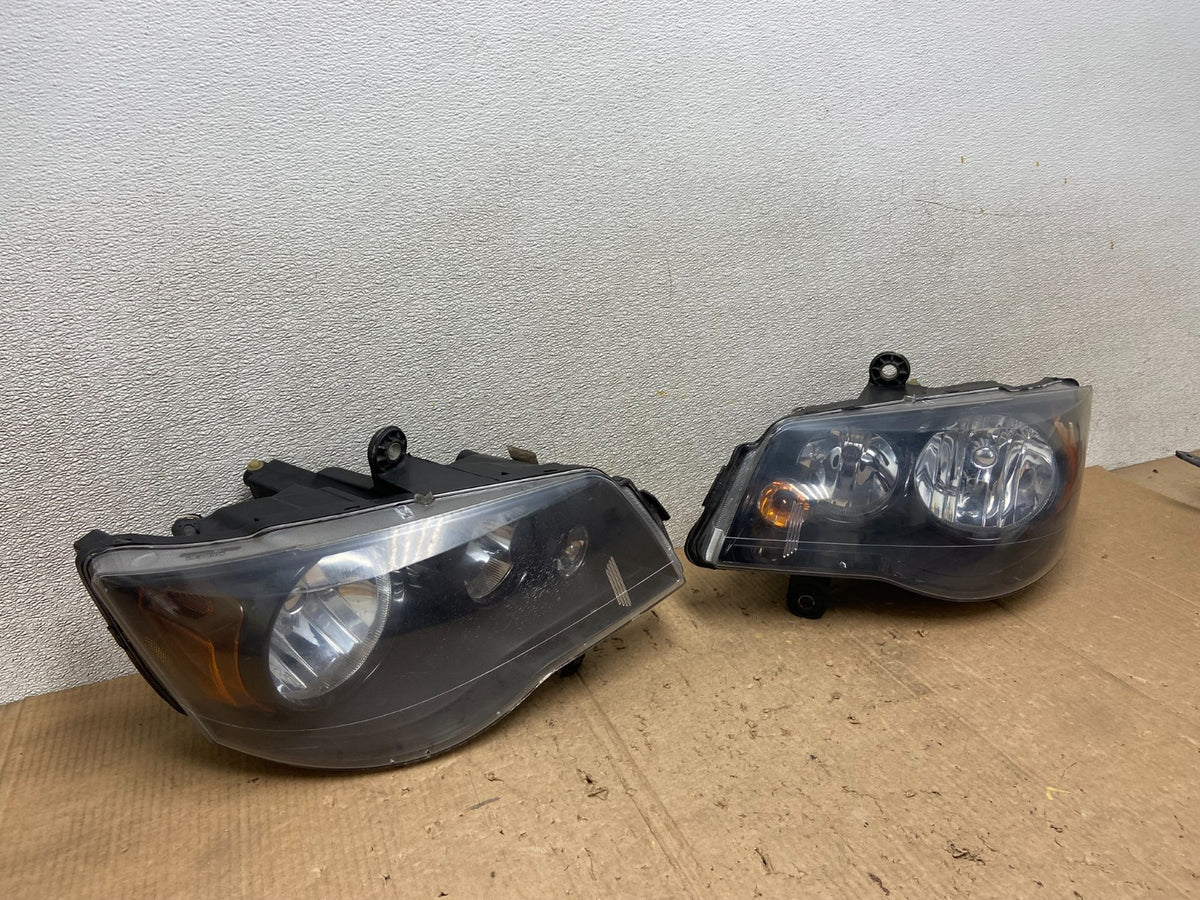 2008 to 2016 Chrysler Town and Country Left+Right Side Headlights AA7122 DW2
