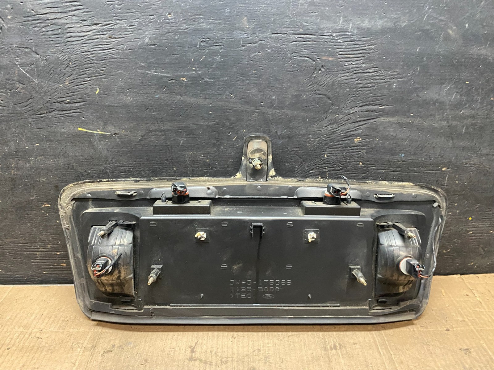 2003 to 2006  Lincoln LS Rear License Plate Trim Panel OEM t4133 DG4