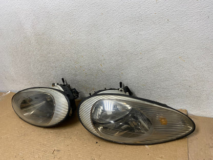 1996 to 1999 Mercury Sable Left+Right Side Set Halogen Headlights AH8393 DW1