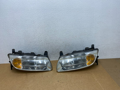2000 to 2002 Saturn L Series Headlights Left+Right Side AE2945 DW0