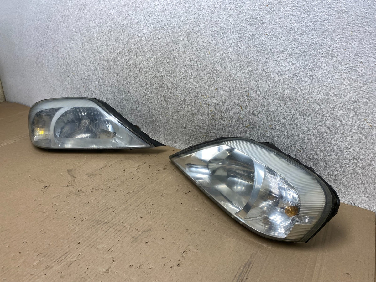 2000 to 2005 Mercury Sable Left+Right Side Halogen Headlights AJ2144 DW1