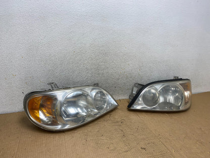 2002 to 2005 Kia Sedona Left+Right Side Headlights AI8165 DW2