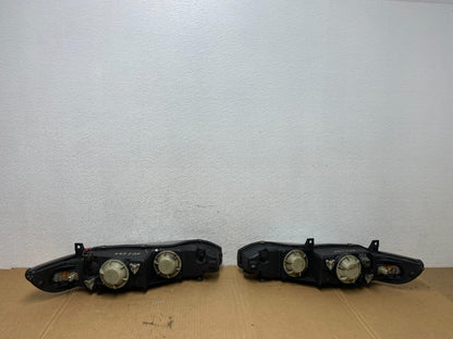1997 to 1998 Mitsubishi Galant Left+Right Set Headlights Halogen AD2675 DW5