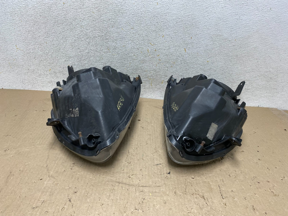 2004 to 2009 Mitsubishi Galant Left+Right Headlights Halogen AH7650 DW10