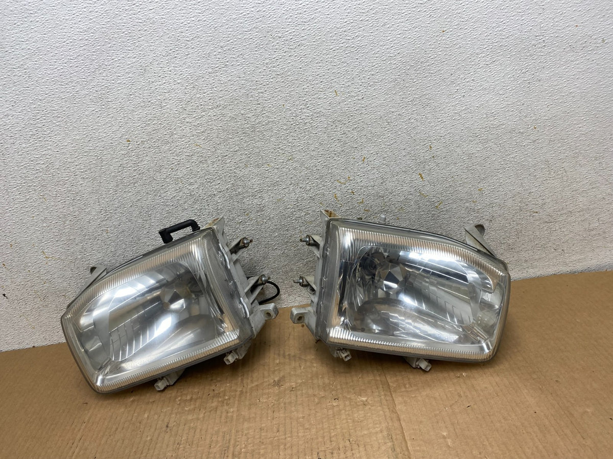 1999-2004 Nissan Pathfinder Left+Right Side Set Halogen Headlights AI6516 DW0