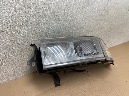 1991 to 1993 Oldsmobile Ninety Eight Left Driver Side Headlight Z39762