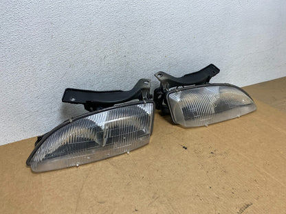 1995 to 1999 Chevrolet Cavalier Left+Right Set Halogen Headlight AE3227 DG2