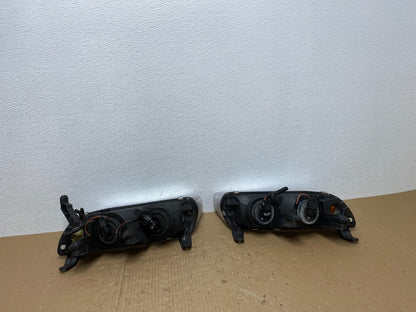 2000 to 2002 Saturn L Series Left+Right Set Halogen Headlights TYC AB6965 DW6