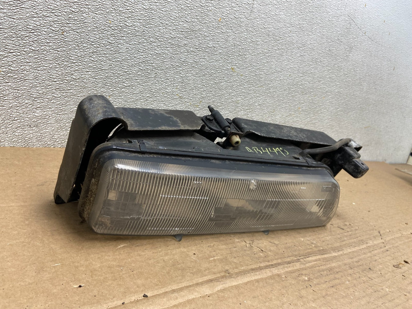 1989 to 1992 Pontiac Sunbird Right Passenger Side Headlight 16509426 AB44982