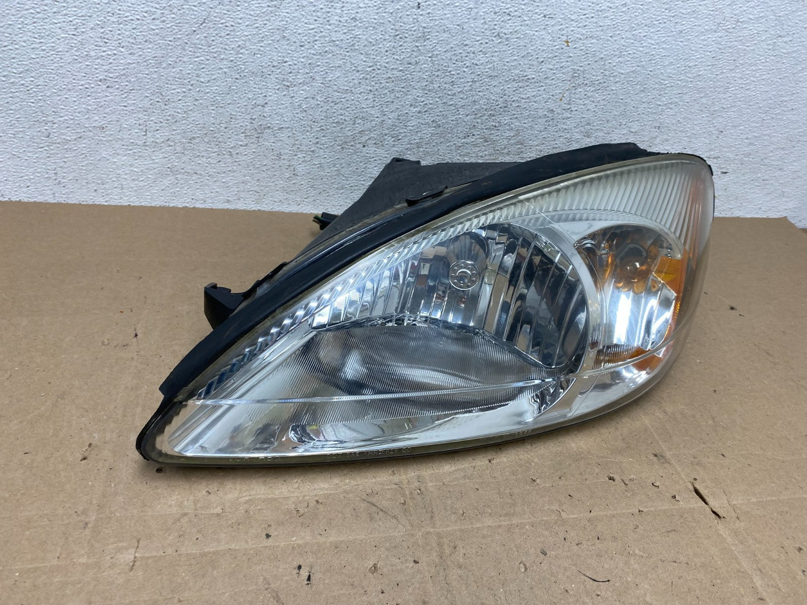 2000 to 2007 Ford Taurus Left Driver LH Side Halogen Headlight TYC AE5953 DW2