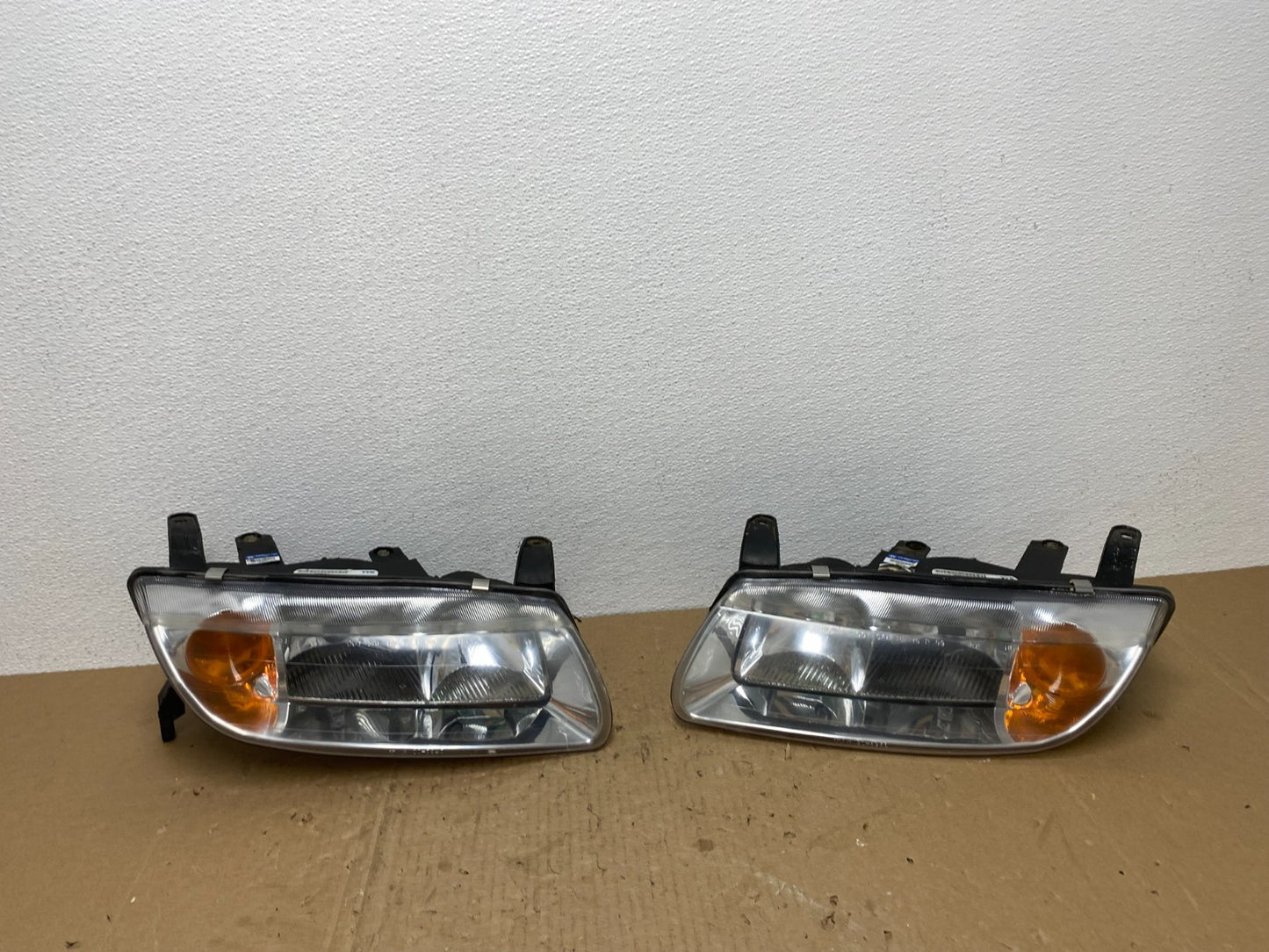 2000 to 2002 Saturn L Series Left+Right Set Halogen Headlights TYC AB6965 DW0
