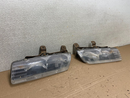 1991 to 1996 Saturn S Series Coupe Left Driver Side Headlights AB13862