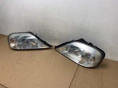 2000 to 2005 Mercury Sable Left+Right Side Halogen Headlights AG5739 DW1