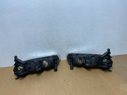2000 to 2002 Saturn L Series Headlights Left+Right Side AE2945 DW7