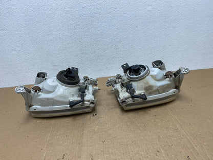 1999-2004 Nissan Pathfinder Left+Right Side Set Halogen Headlights AC5823 DW6