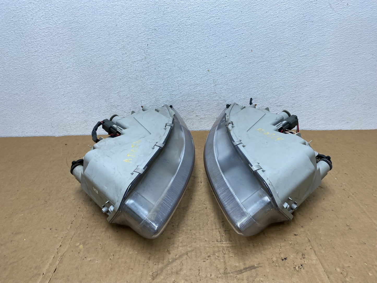 1995 to 1996 Chrysler Sebring Coupe Left+Right Side Headlights AD0514 DW8