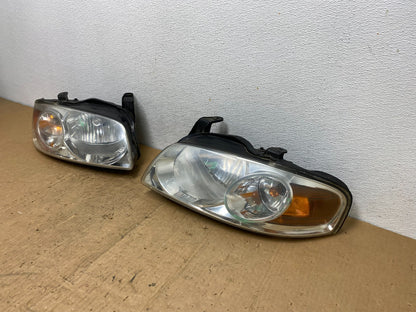 2004 - 2006 Nissan Sentra Halogen Left+Right Headlights TYC AD0566 DW1