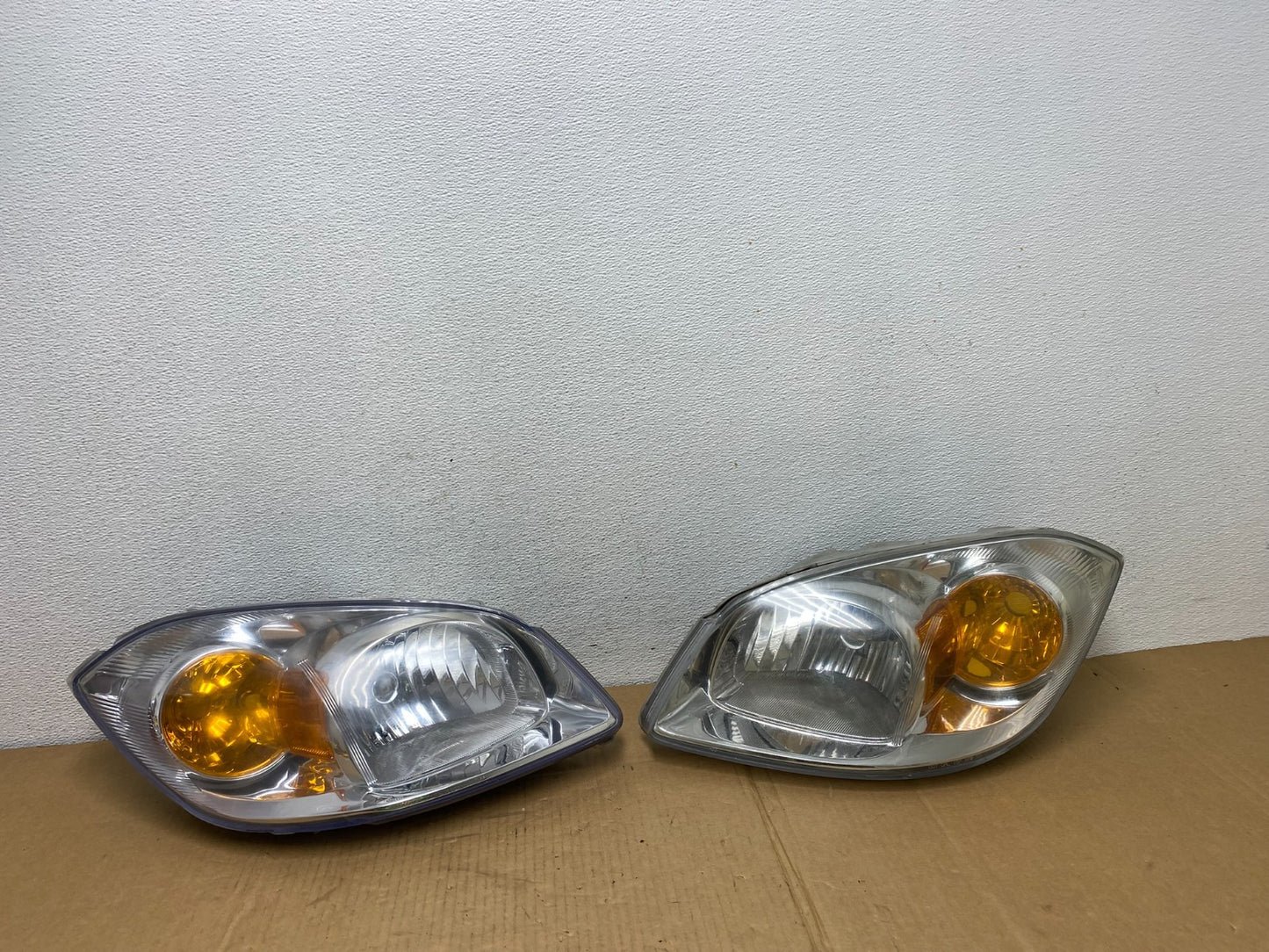 2005 - 2010 Chevrolet Cobalt Sedan Left+Right Set Headlights AC7552 DW0