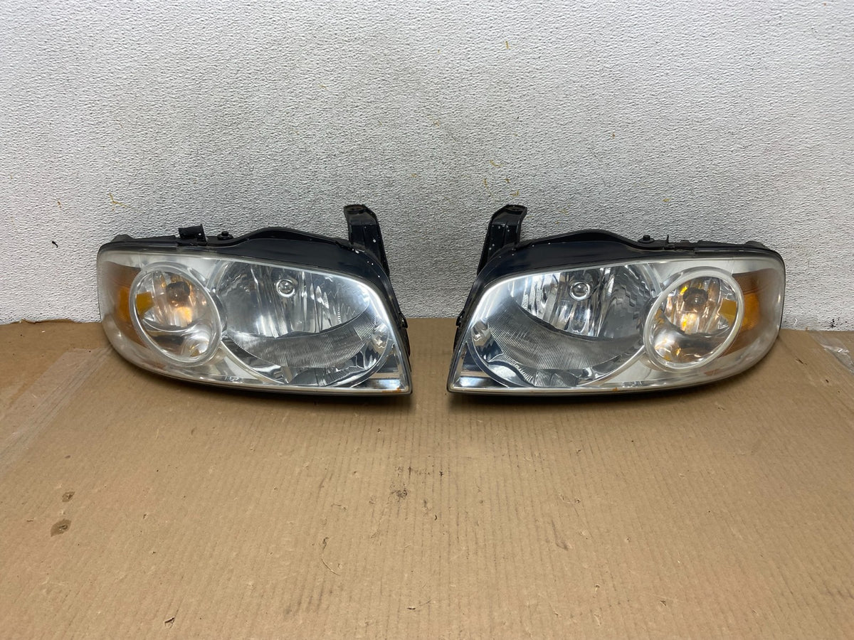 2004 - 2006 Nissan Sentra Halogen Left+Right Headlights AH3044 DW0
