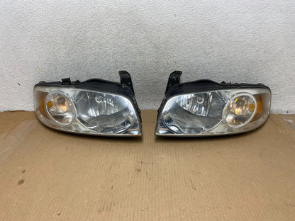 2004 - 2006 Nissan Sentra Halogen Left+Right Headlights AH3044 DW0