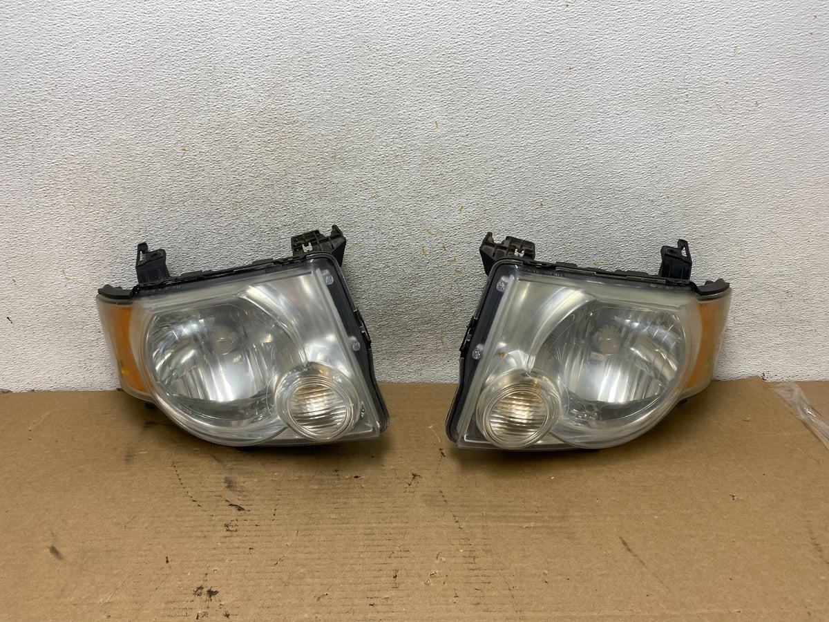 2008 to 2012 Ford Escape Headlights Left+Right Side Set Halogen AH4200 DW0