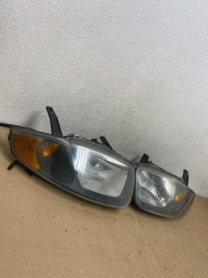 2003 - 2005 Chevrolet Cavalier Left+Right Side Black Set Headlights AG4768 DW1