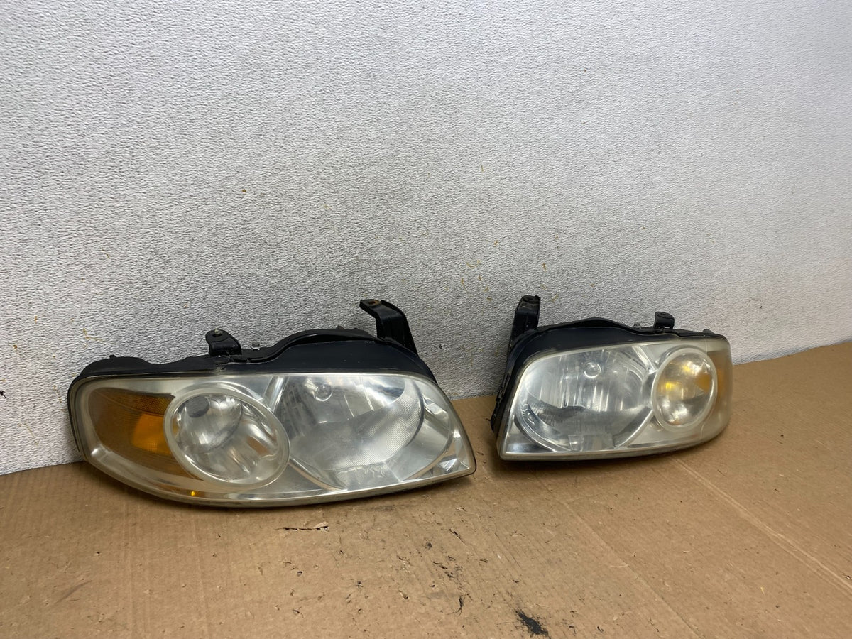 2004 - 2006 Nissan Sentra Halogen Left+Right Headlights AI8983 DW2