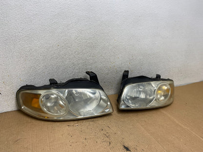 2004 - 2006 Nissan Sentra Halogen Left+Right Headlights AI8983 DW2