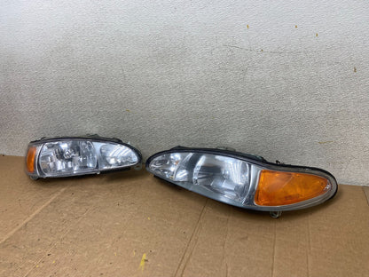 1998 to 2003 Ford Escort Left+Right Set Halogen Headlight Aftermarket AA1630 DG1