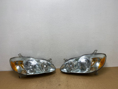 2003 to 2004 Toyota Corolla Left+Right Side Set Headlights AD0645 DW0