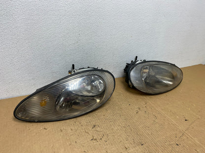 1996 to 1999 Mercury Sable Left+Right Side Set Halogen Headlights AC8121 DG2