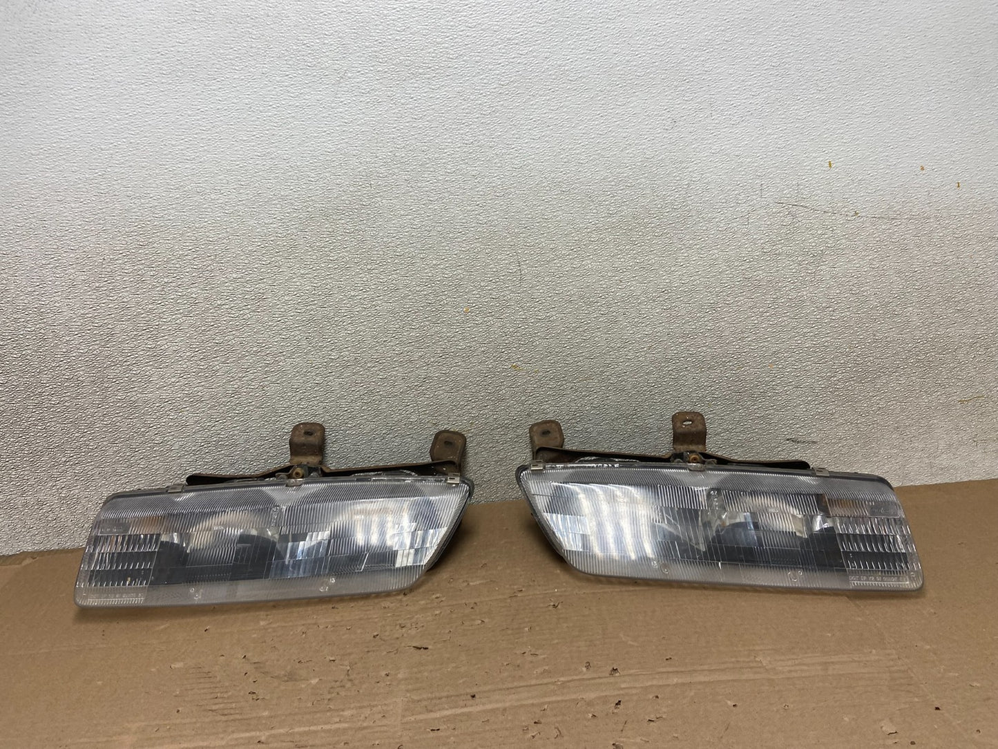 1991 to 1996 Saturn S Series Coupe Left Driver Side Headlights AB13860