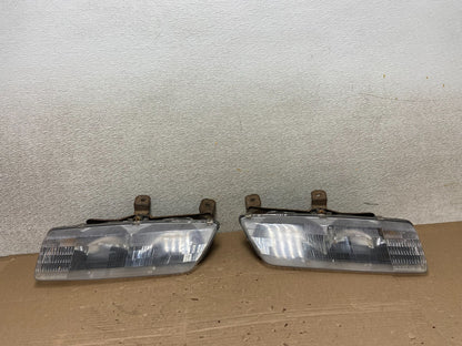 1991 to 1996 Saturn S Series Coupe Left Driver Side Headlights AB13860